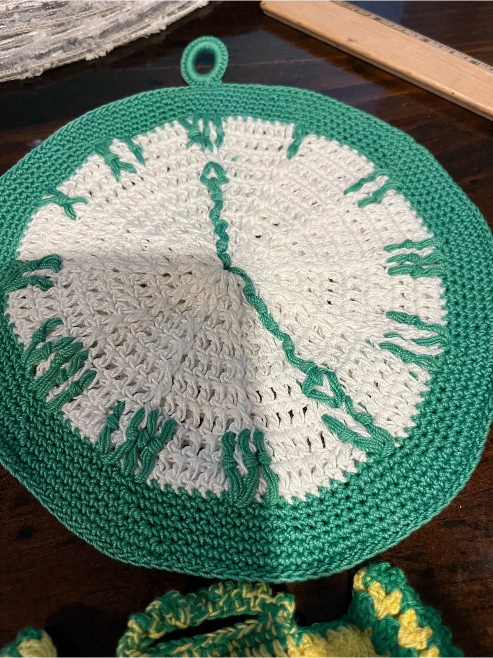 Handmade Green and Yellow Crochet Kitchen Dress Pot Holder and a clock crocheted